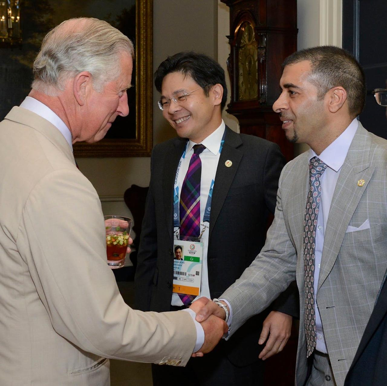 Gurdip Dev Bath shaking hands with King Charles III at a reception