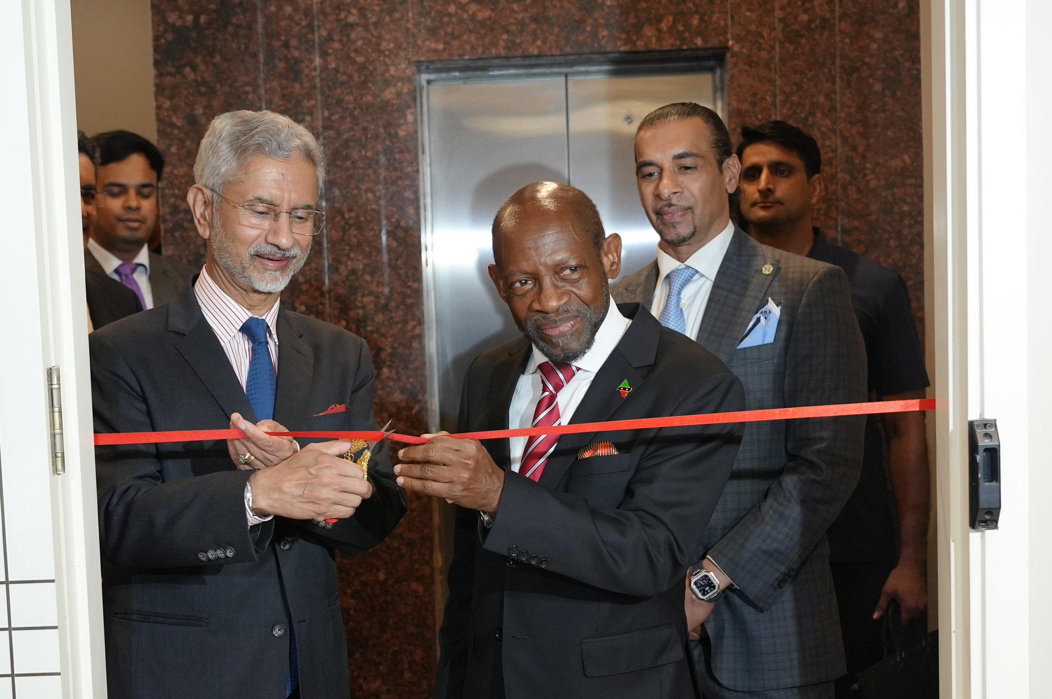 Gurdip Dev Bath and dignitaries cutting the ribbon at the High Commission inauguration